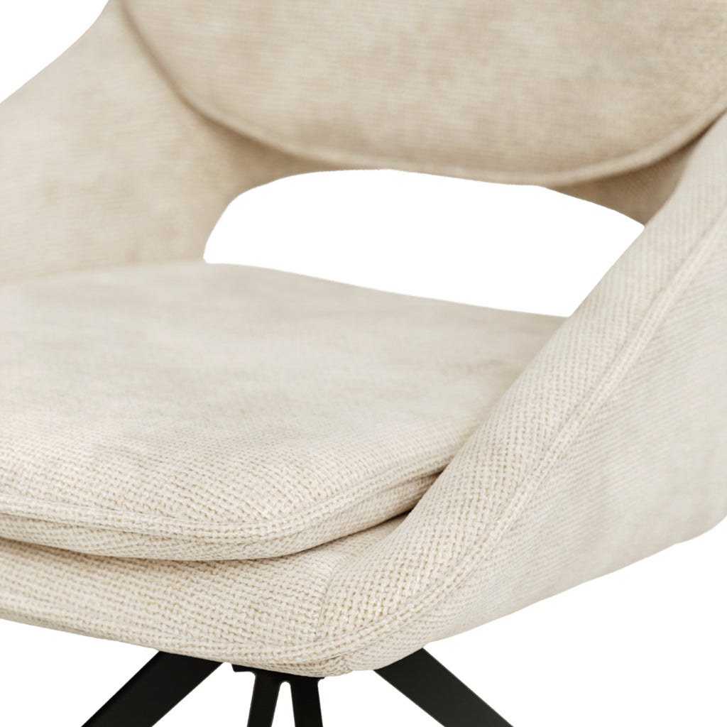 Elevate your dining space with this sophisticated pair of off-white dining chairs from Harry Christian Home. Crafted from premium chenille weave fabric, each chair features a gently curved seat with an elegant cutout detail, complemented by plush cushioning for superior comfort. The sleek black metal swivel base adds contemporary flair whilst ensuring effortless movement. Perfect for modern interiors seeking the ideal balance of style and functionality, these chairs transform any dining area into a refined 